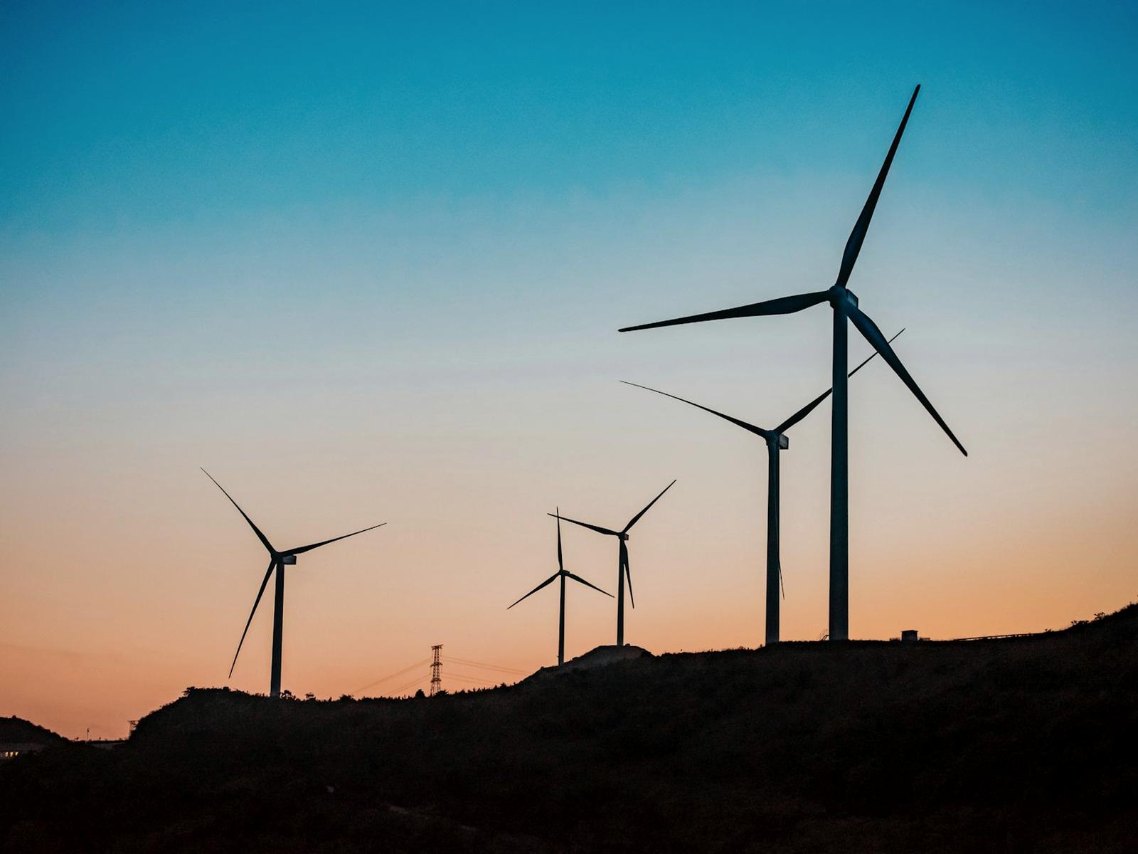 Wind turbines on a ridge line at dusk